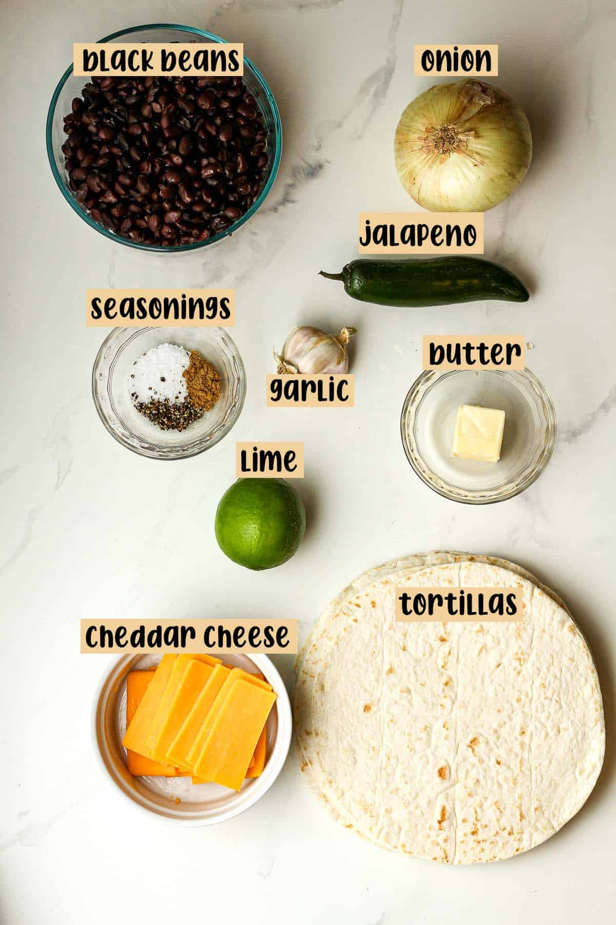 Labeled ingredients for black bean tacos.