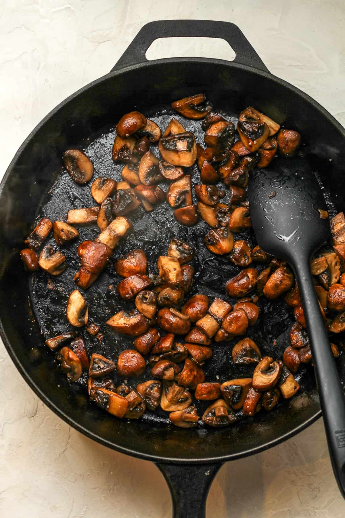 A skillet of the browned mushrooms.