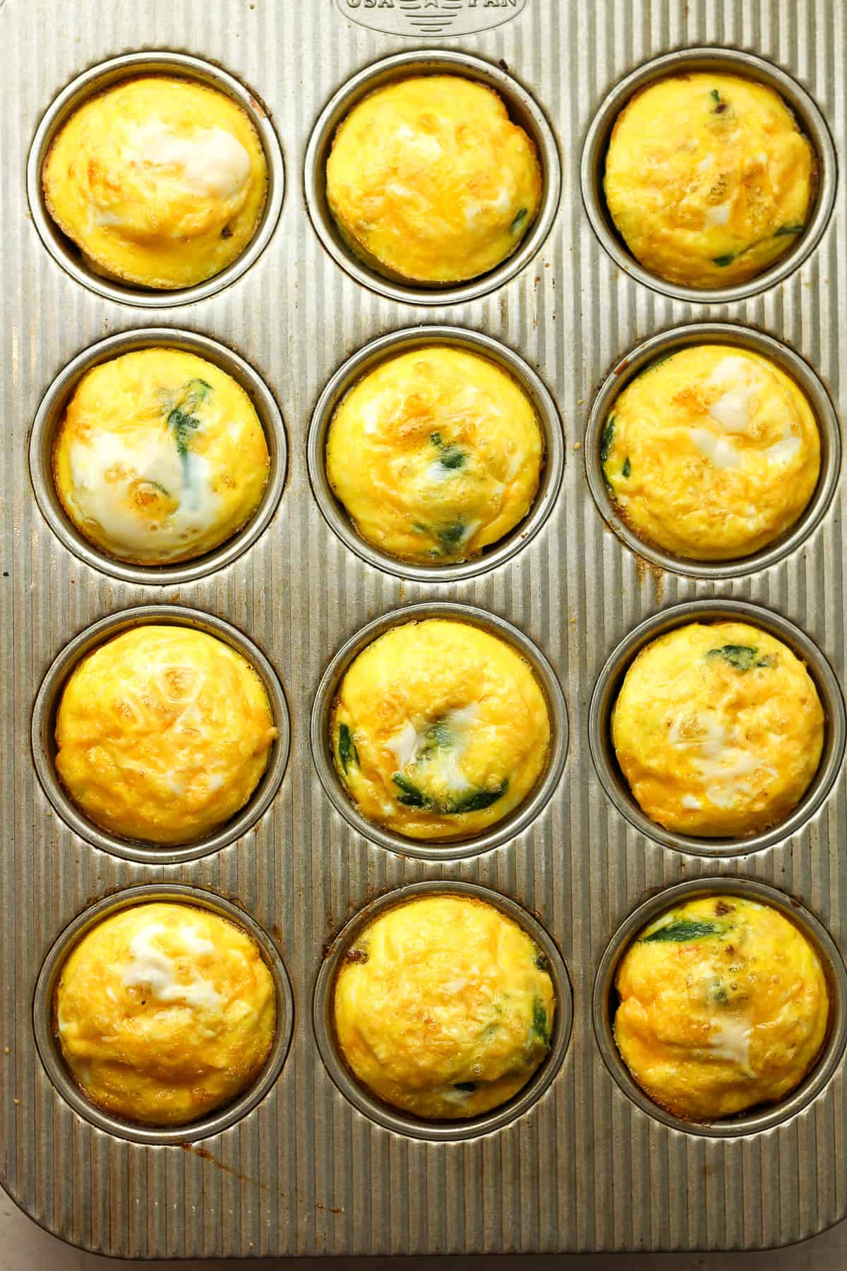 A muffin tin with baked egg cups.