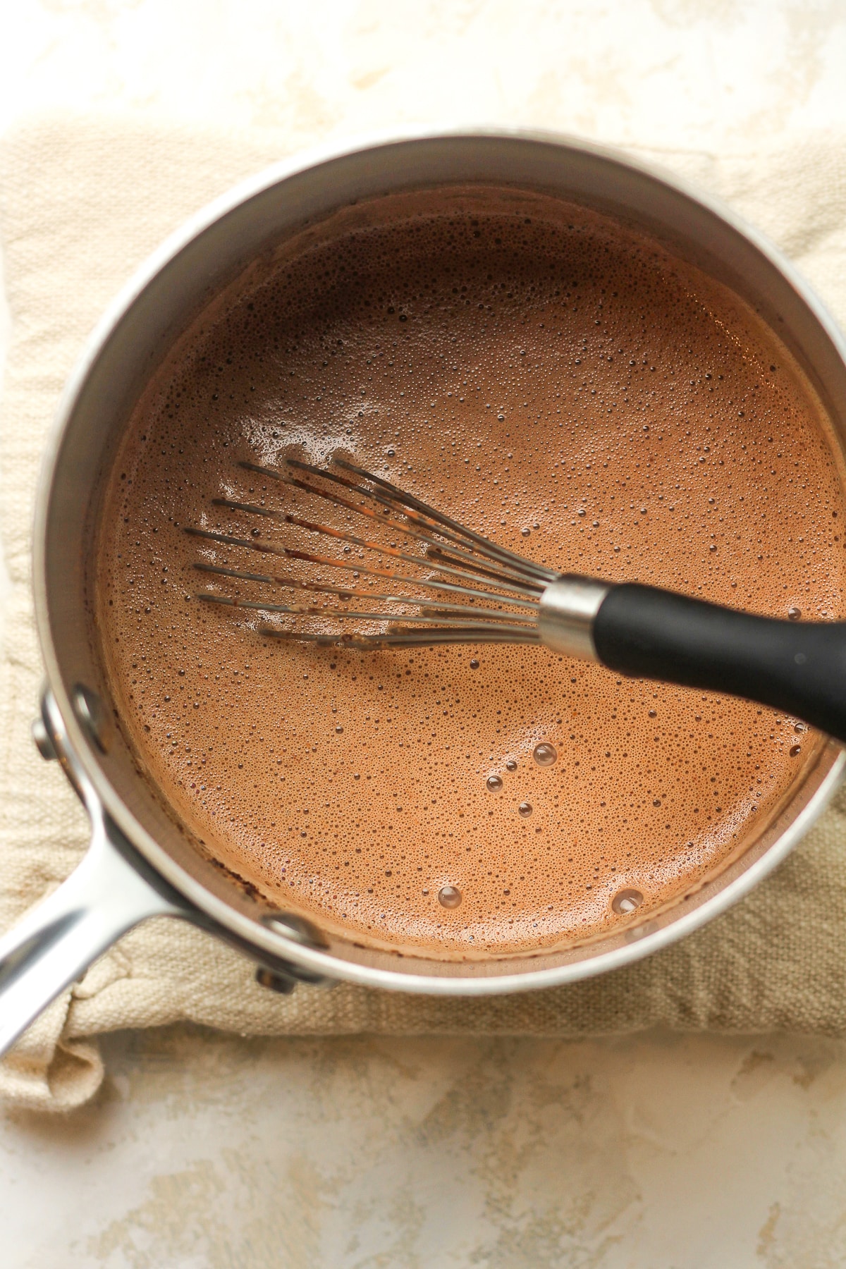 A pan of the tempered egg mixture plus cocoa powder.