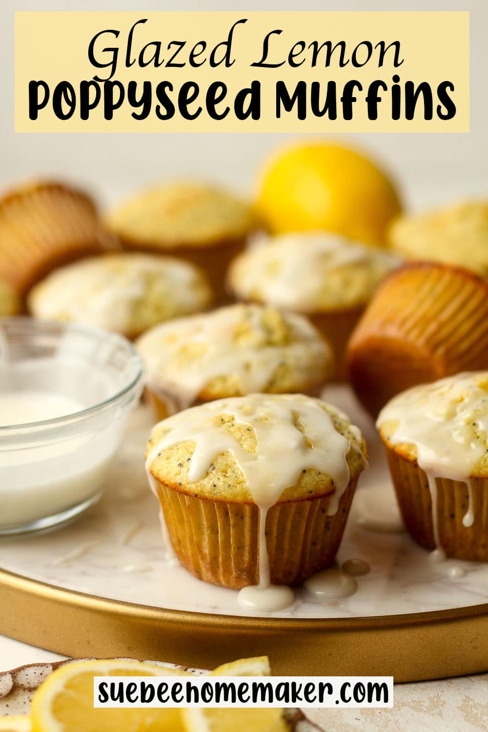 Side view of a tray of glazed lemon poppyseed muffins.