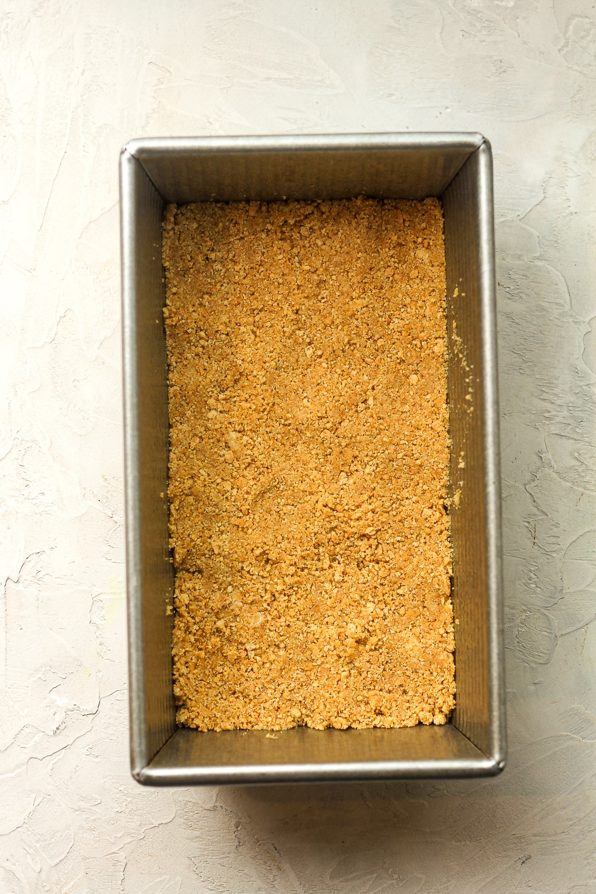 A loaf pan of the graham mixture.