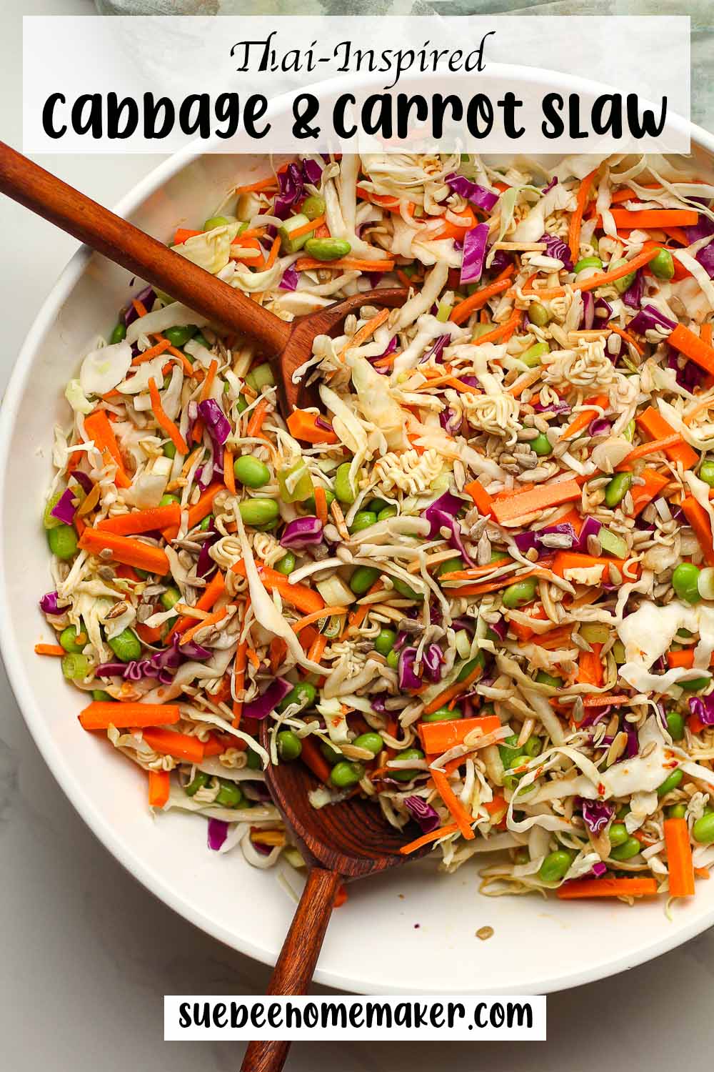 A large bowl of Thai Inspired cabbage and carrot slaw.