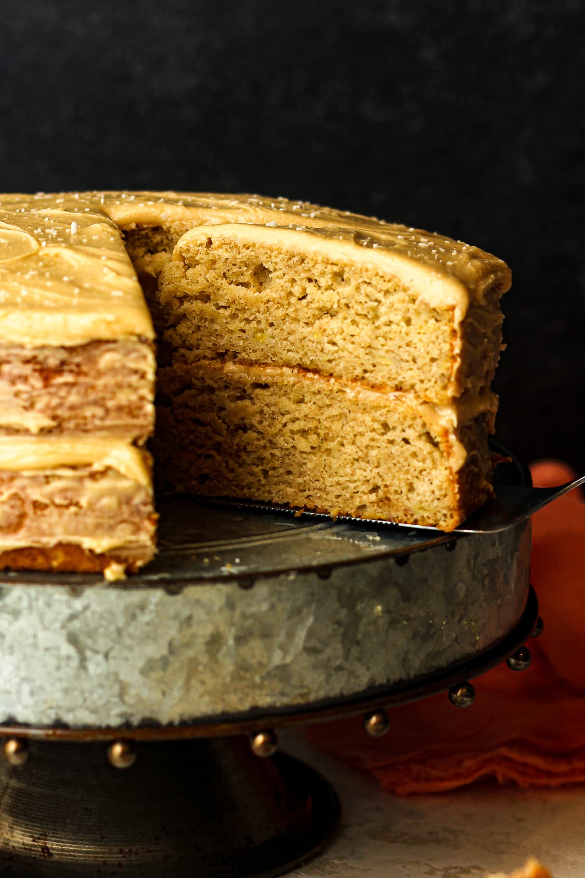 Closeup on a slice of brown butter layered banana cake.