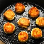A skillet of fried goat cheese.