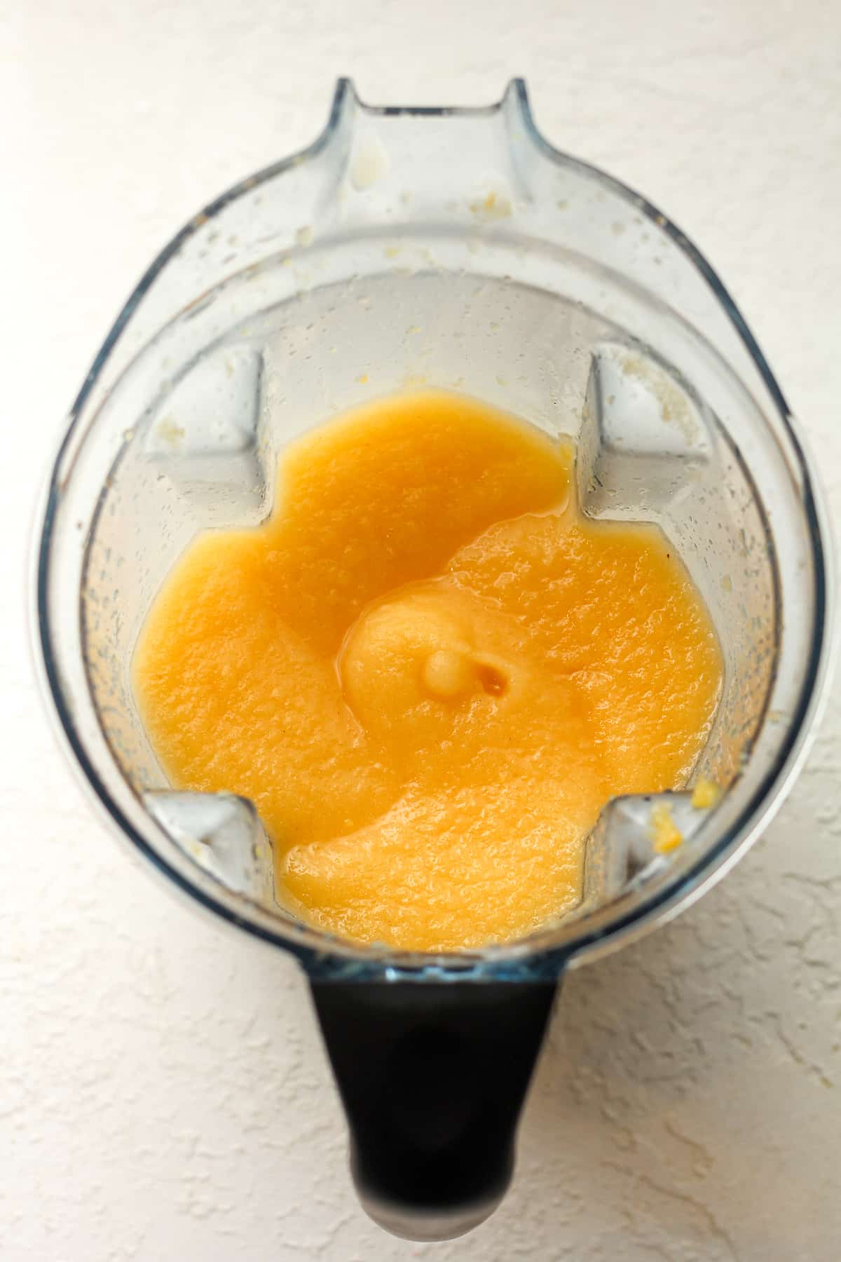 A blender of pureed peaches.
