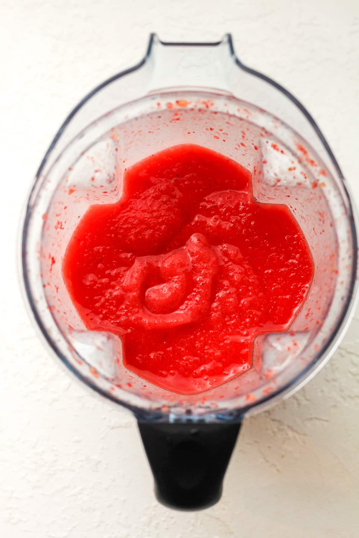 A blender of pureed strawberry margaritas.