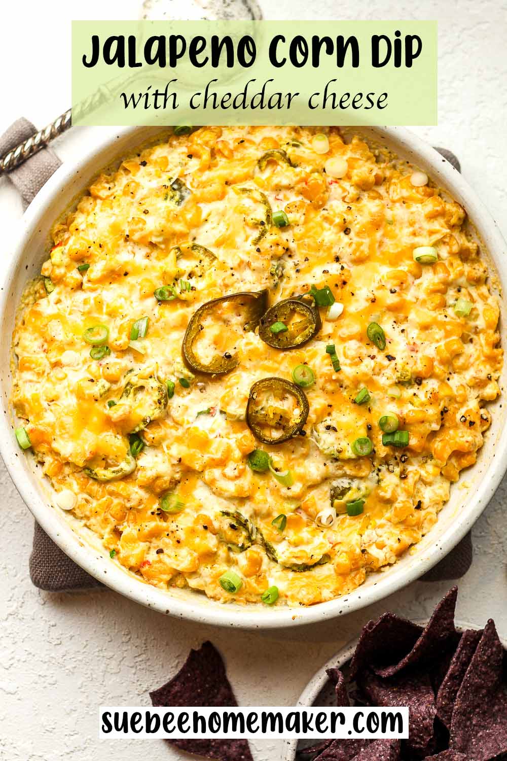 A bowl of jalapeno corn dip with cheddar cheese.