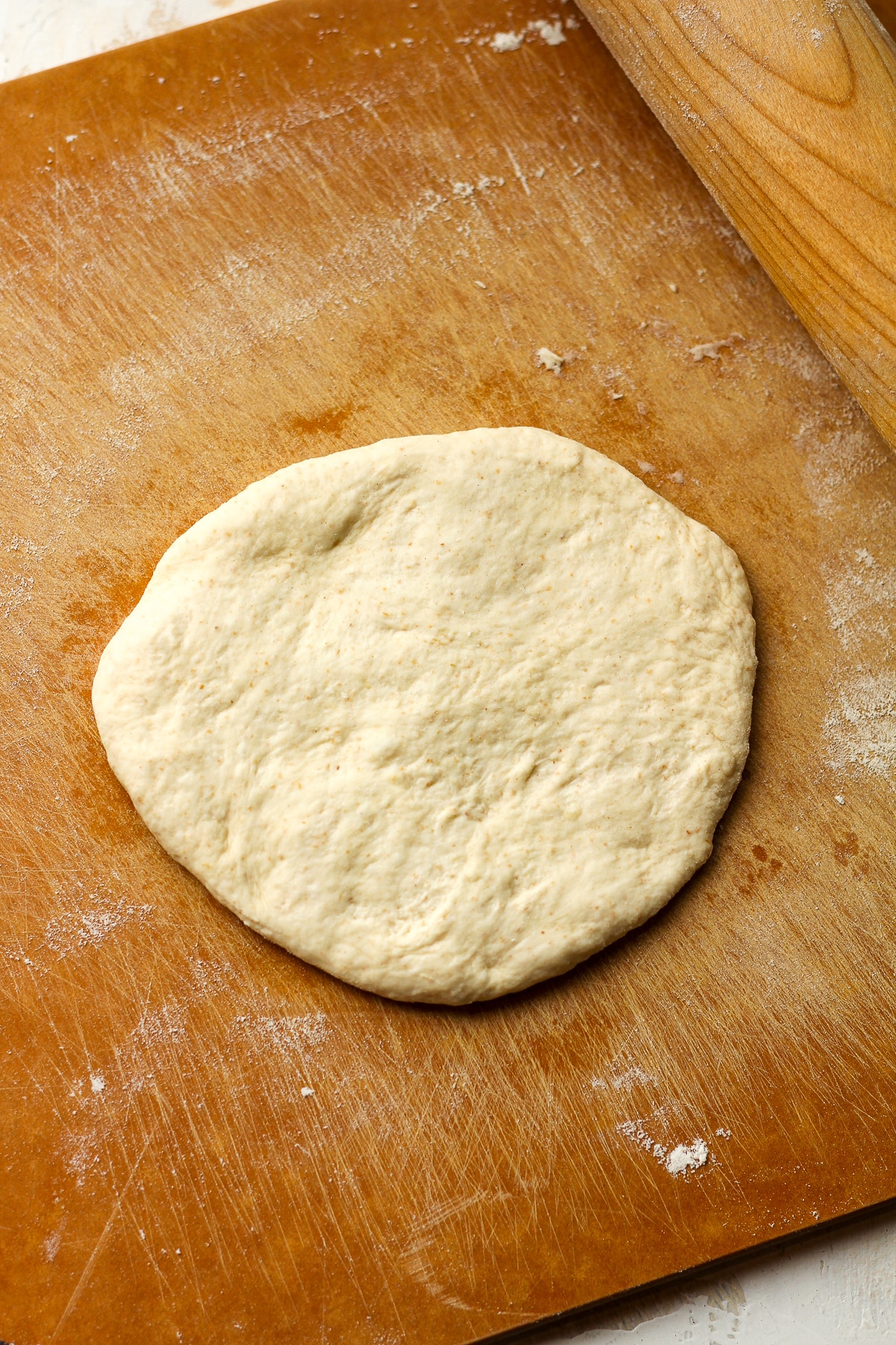 A rolled out sourdough round.