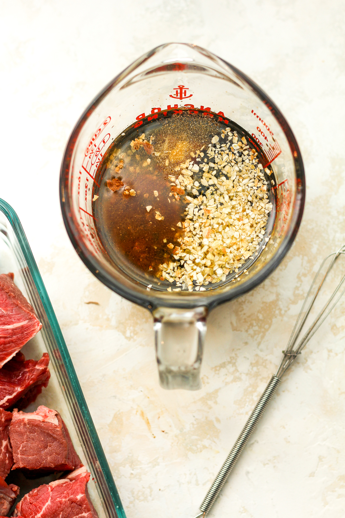 A measuring cup of the steak marinade.