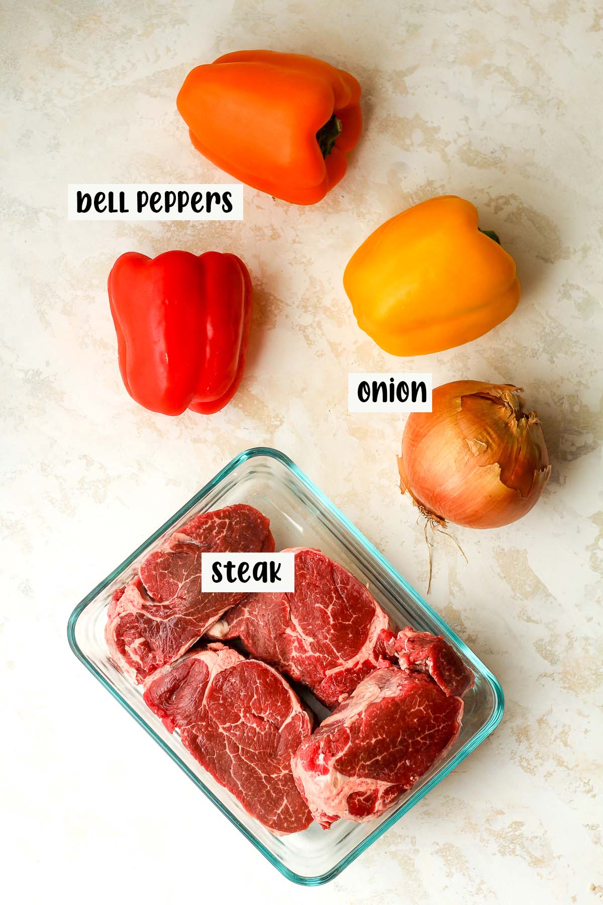 The labeled bell peppers, onions, and steak.