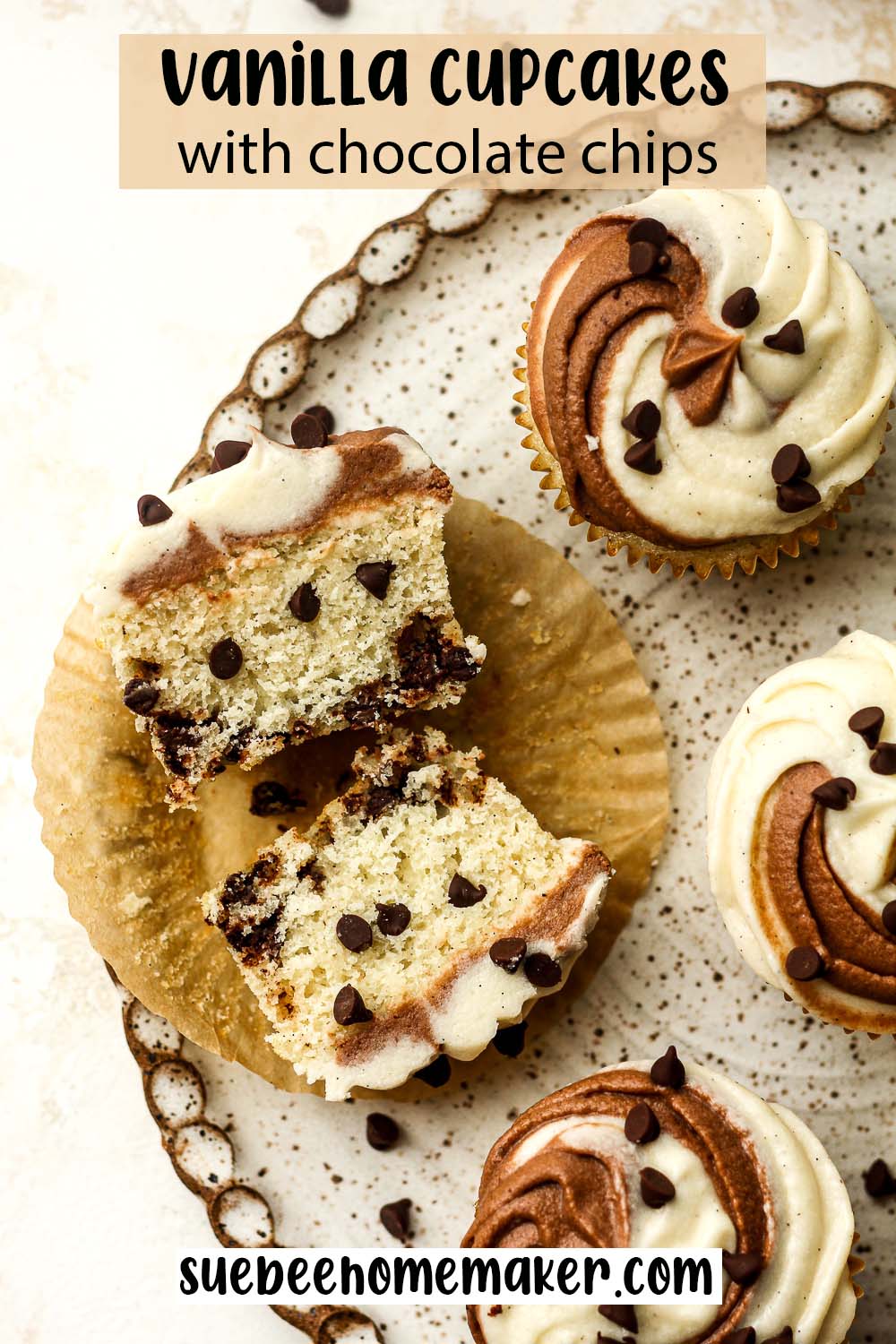 A plate of vanilla cupcakes with chocolate chips and one cut open showing the inside.