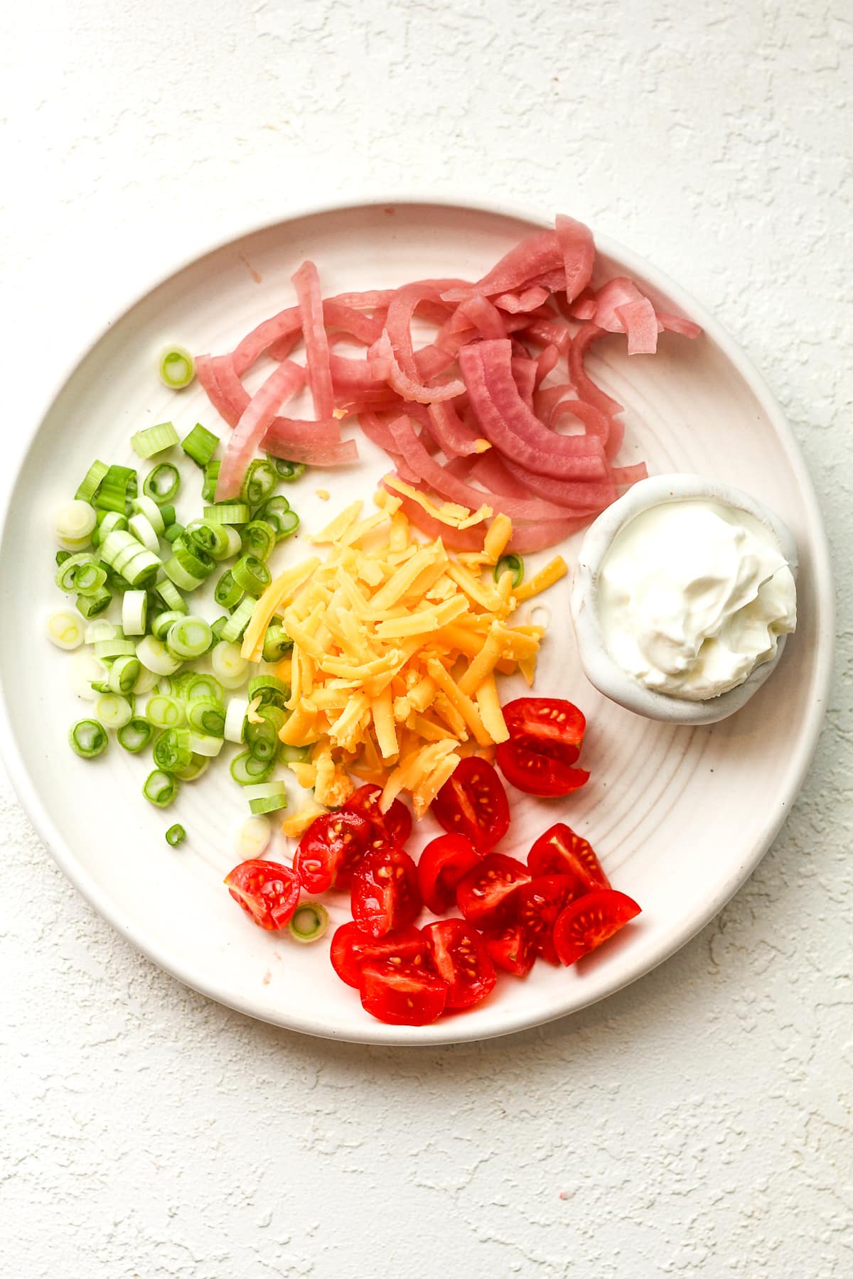 A plate of toppings.