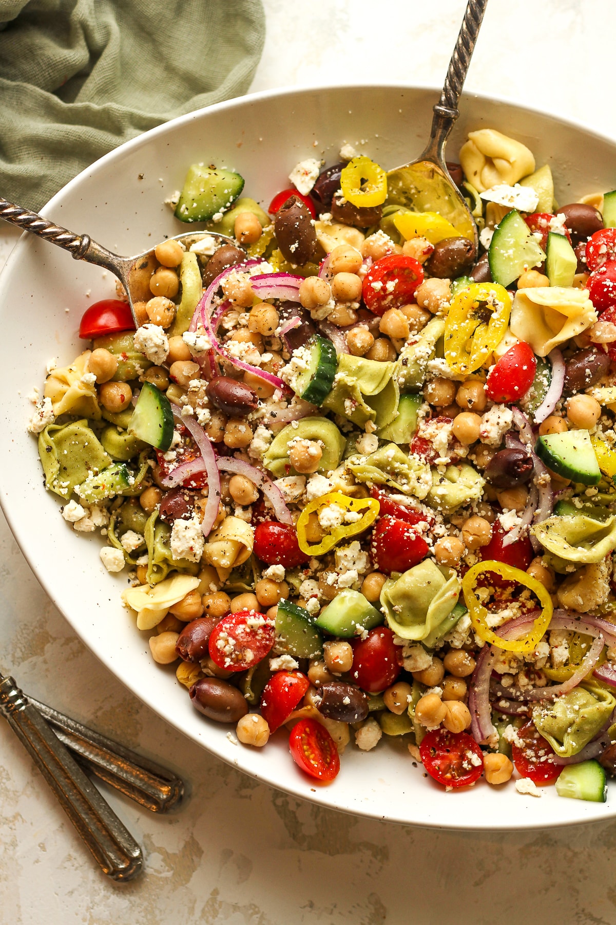 A bowl of pasta salad with tortellini.