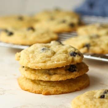 A stack of three blueberry lemon cookies.