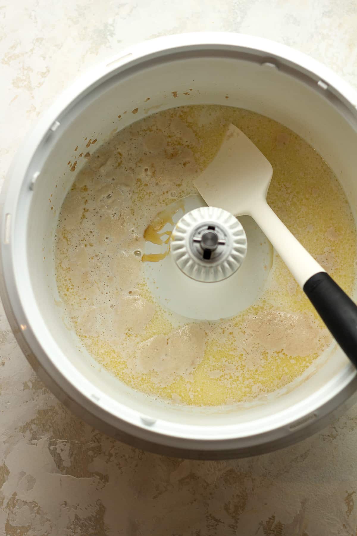 A mixer with the wet ingredients.