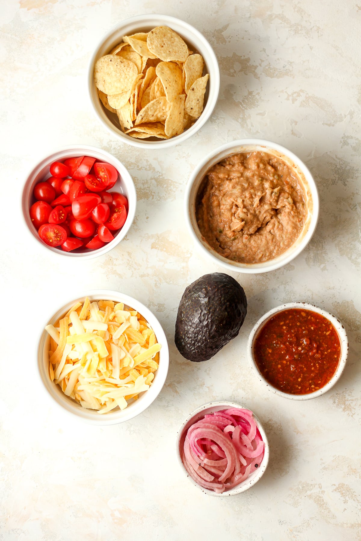 The topping ingredients for the taco bowls.