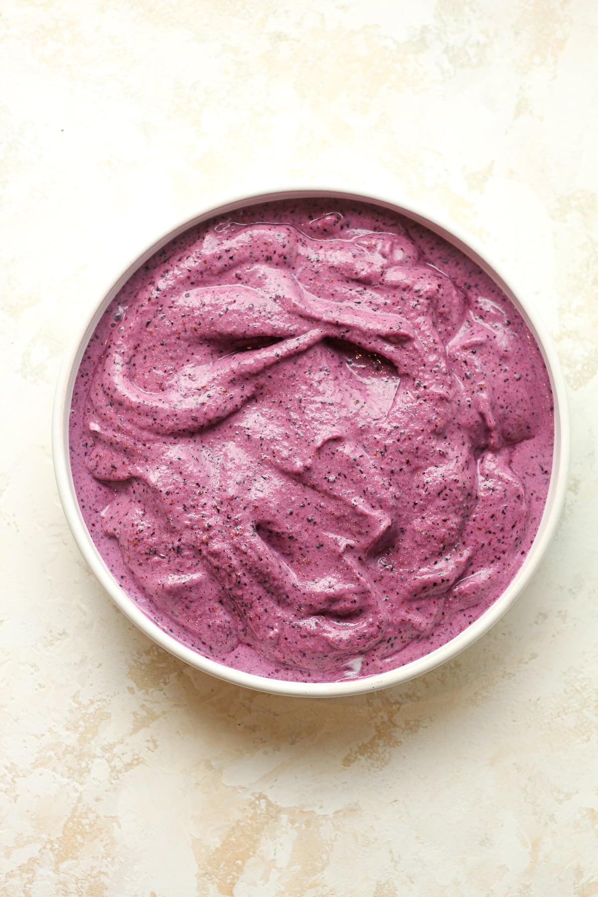 A bowl with the blueberry puree before toppings.