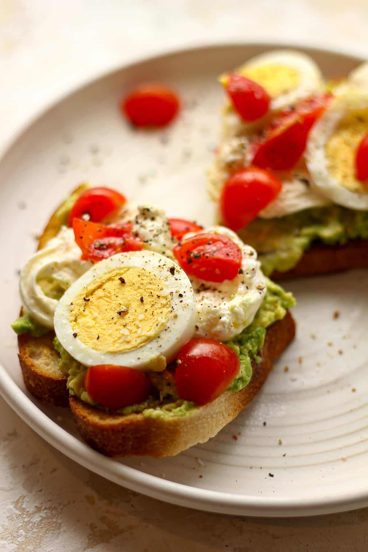 Side view of a plate with burrata toast.