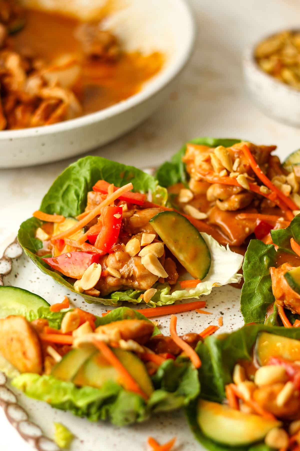 Side view of some chicken lettuce wraps.