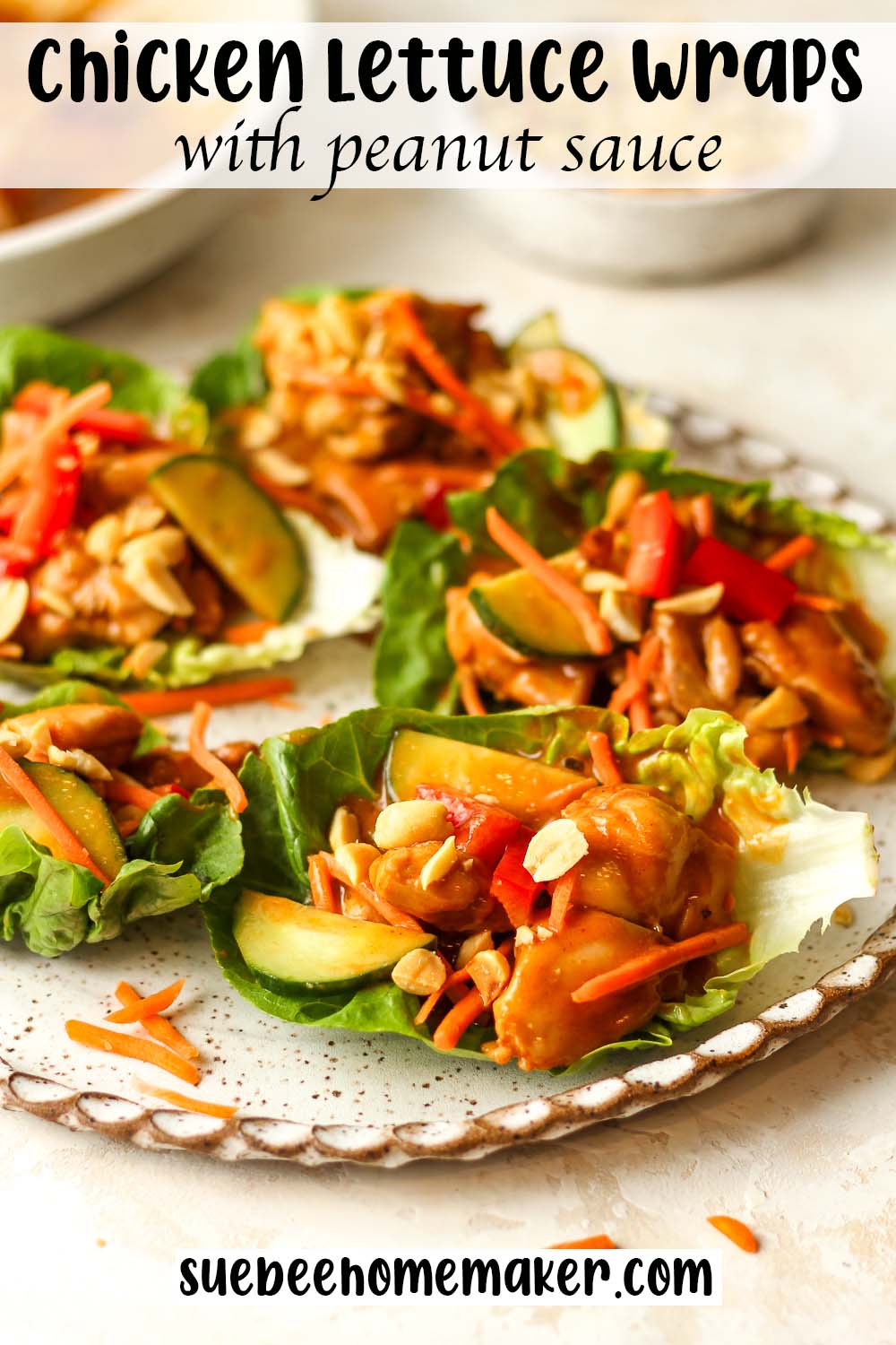 Side view of several chicken lettuce wraps with peanut sauce.