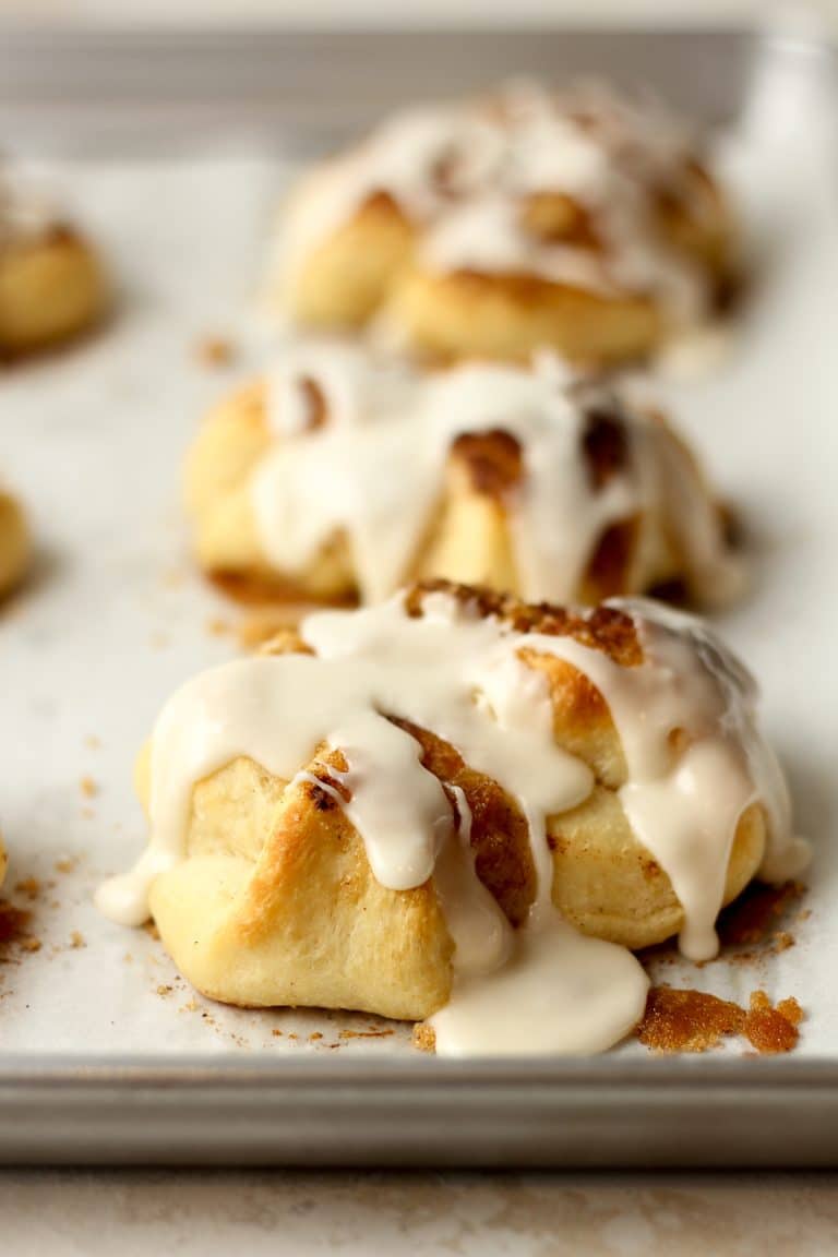 Side view of a pan of cinnamon roll knots.