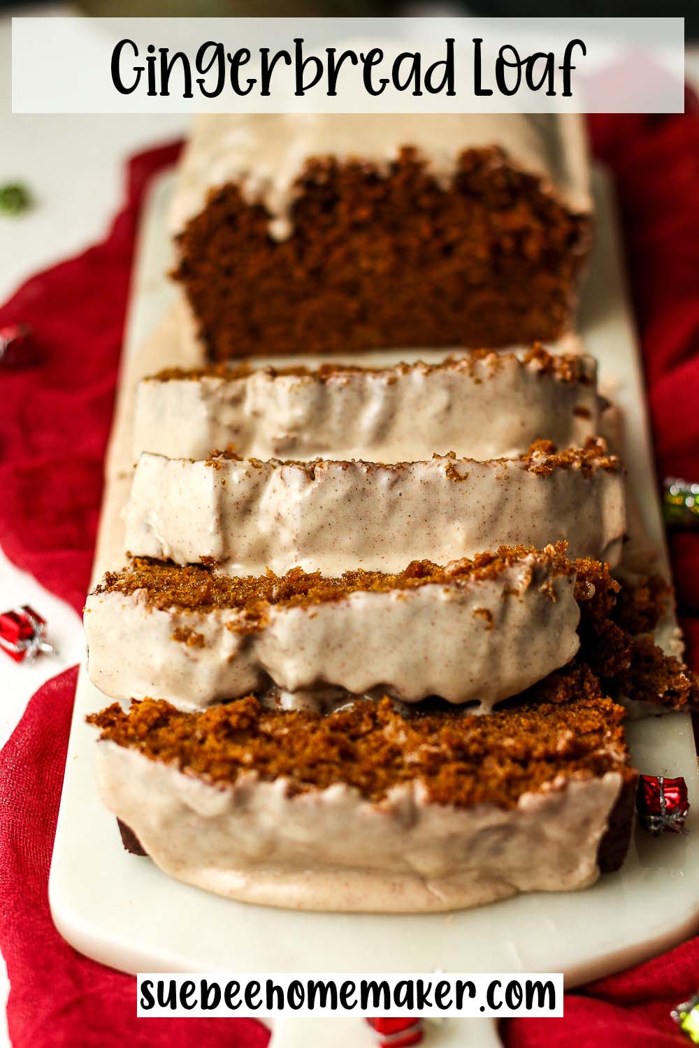 Side view of a sliced and glazed gingerbread loaf.