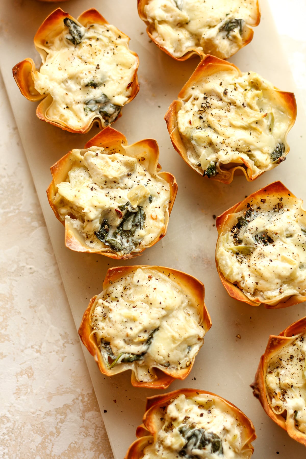 A tray of artichoke bites in wonton wrappers.