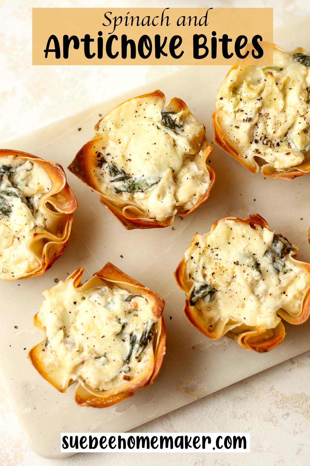 A tray of spinach and artichoke bites.