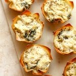 A tray of spinach and artichoke bites.