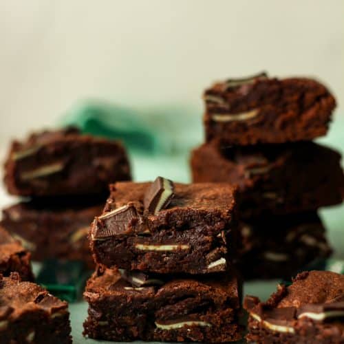 Side view of some stacked Andes chocolate brownies.