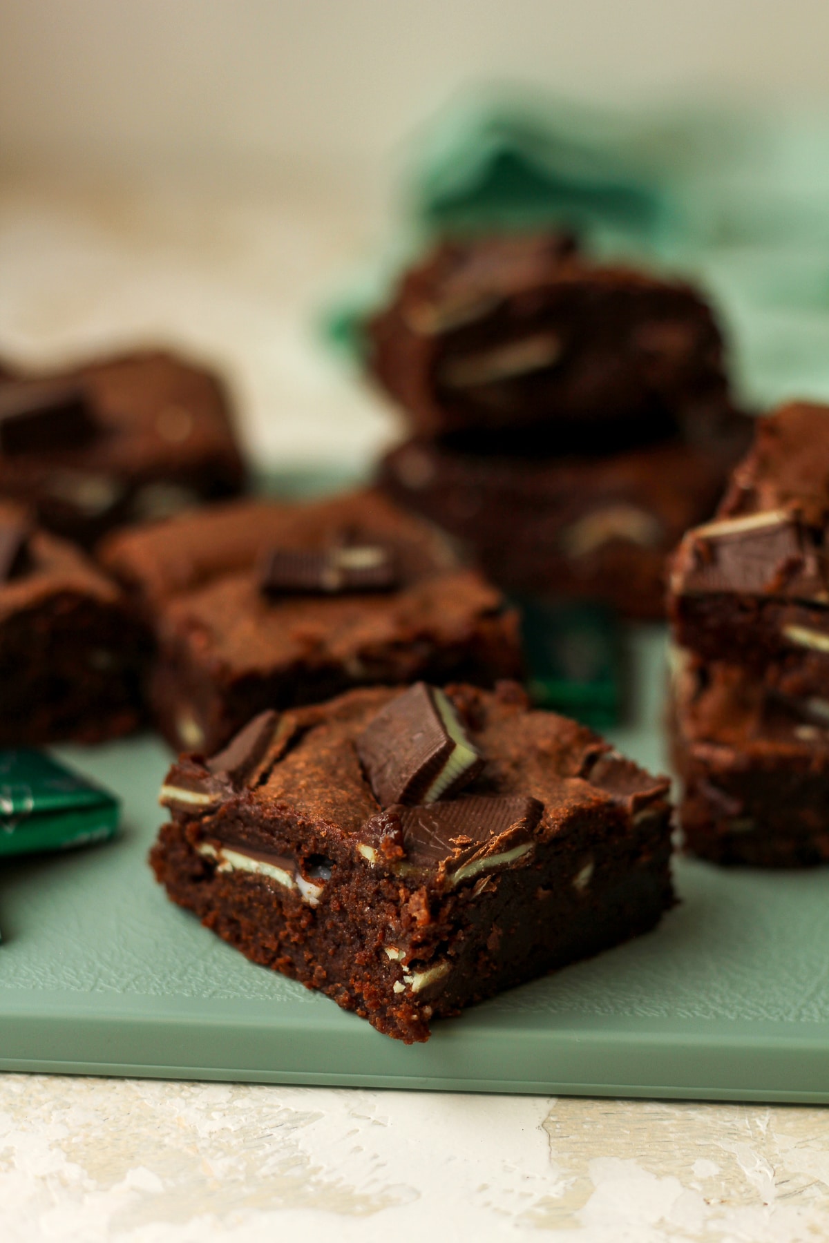 Side view of a square of Andes brownies with others in the background.