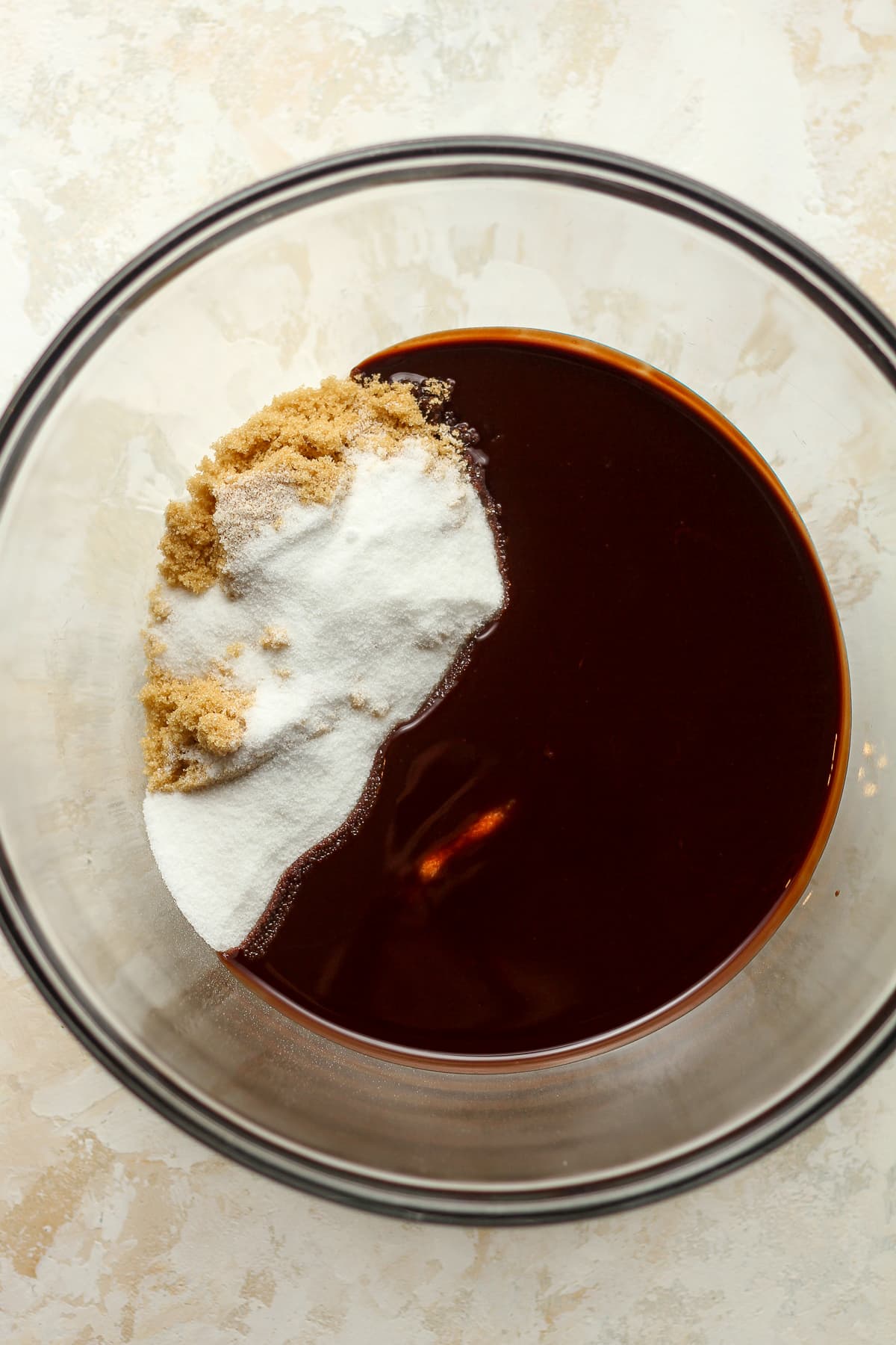 A bowl of the chocolate with the sugars.