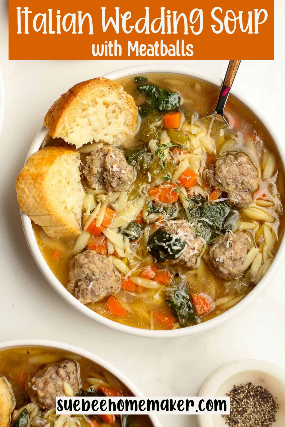 Overhead view of a bowl of Italian Wedding Soup with meatballs.