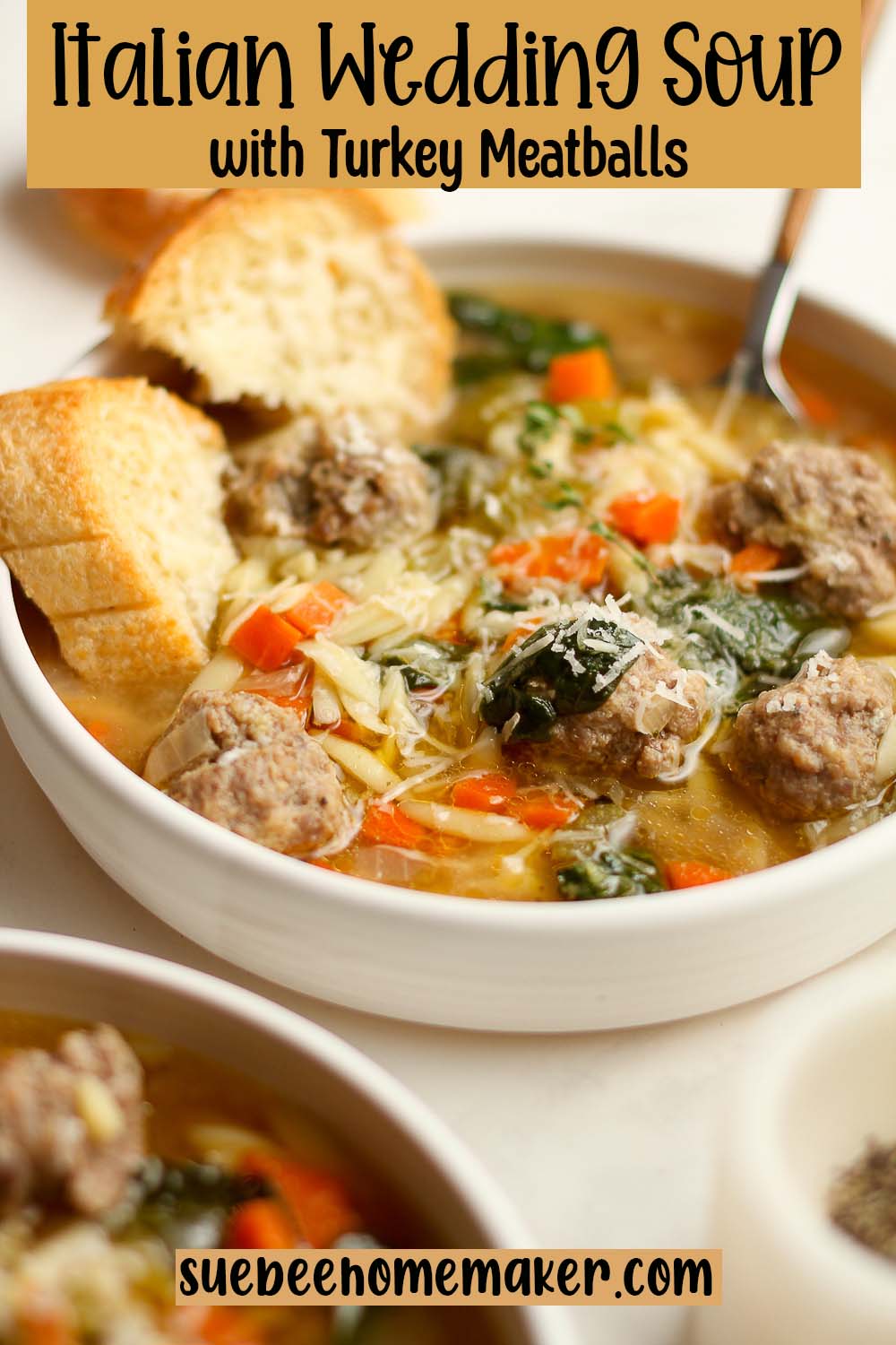 Side view of a bowl of Italian Wedding Soup with turkey meatballs.