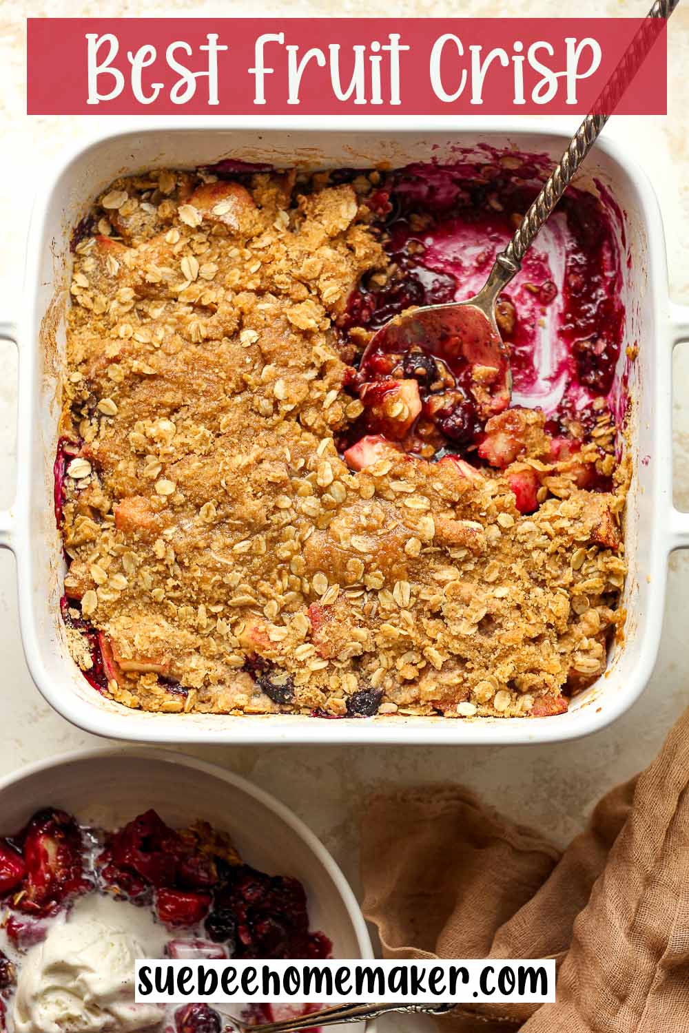 A square dish of the best fruit crisp with a serving spoon.