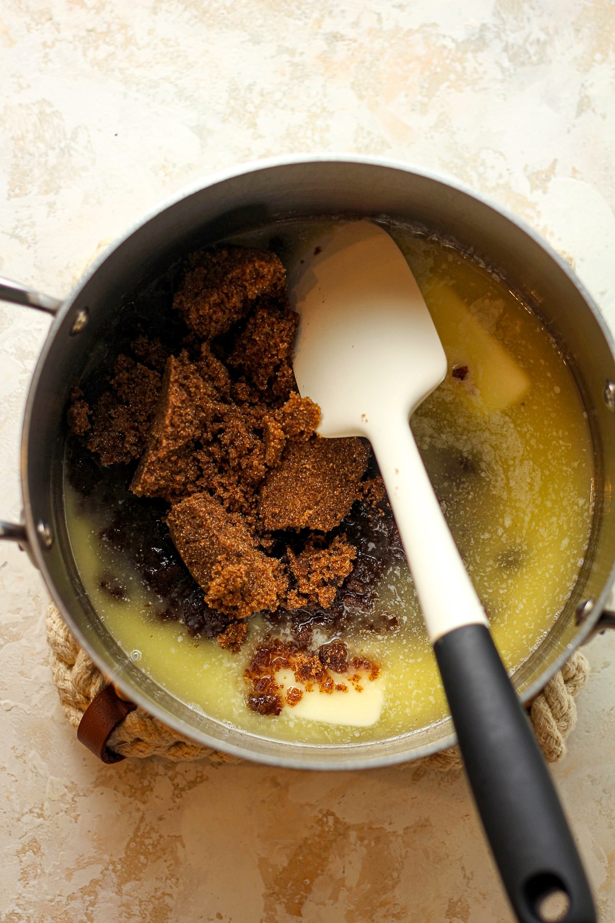 A pan of the butter and dark brown sugar.