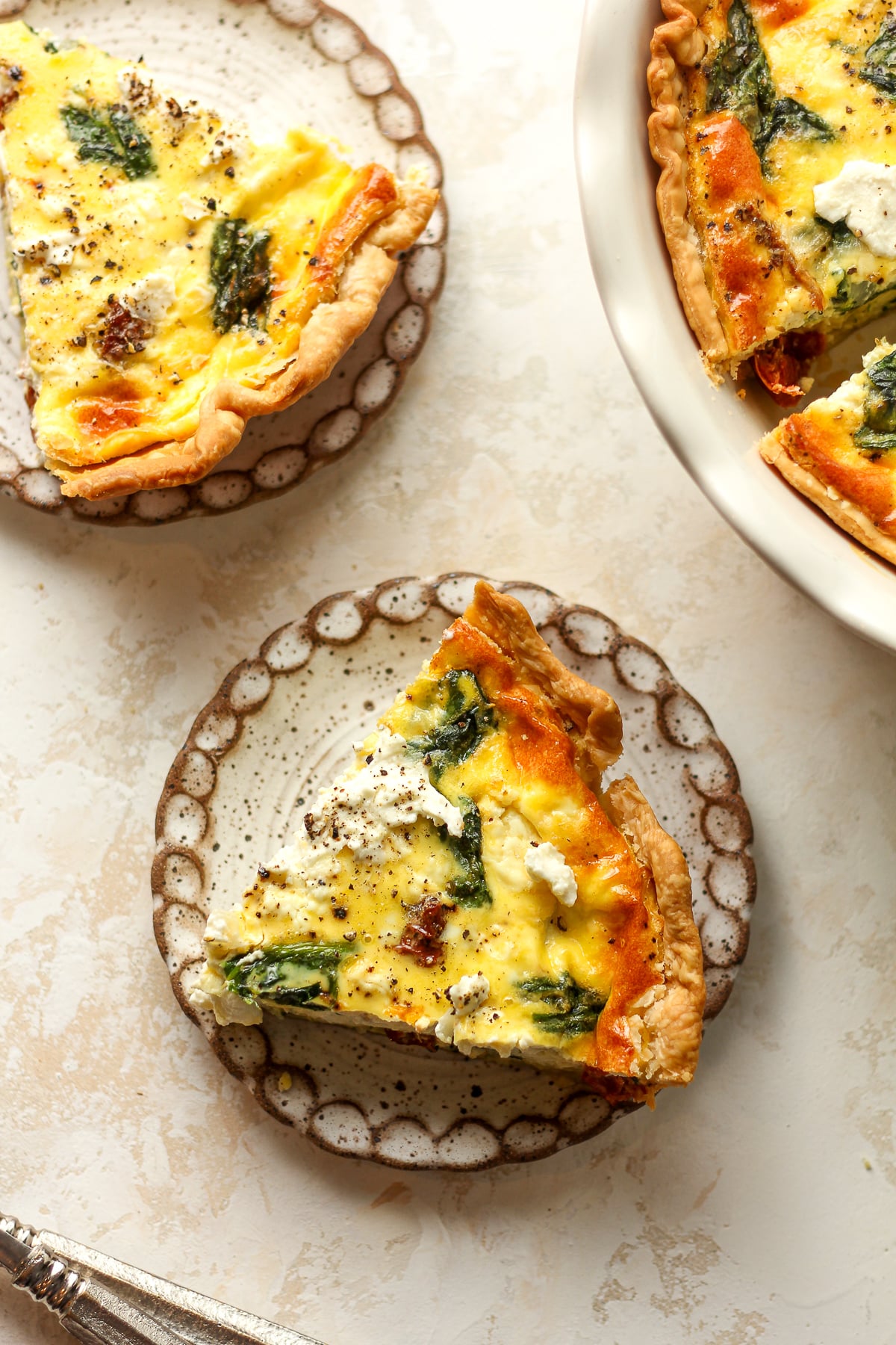 Overhead view of two slices of quiche.