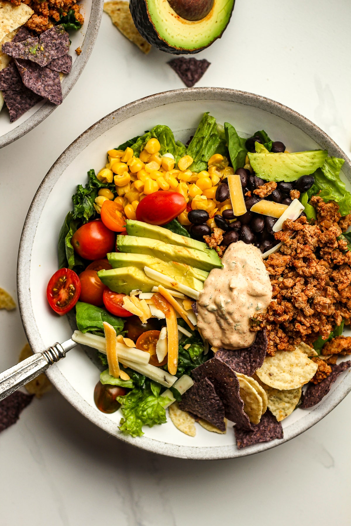 A bowl of the taco salad showing all of the ingredients.