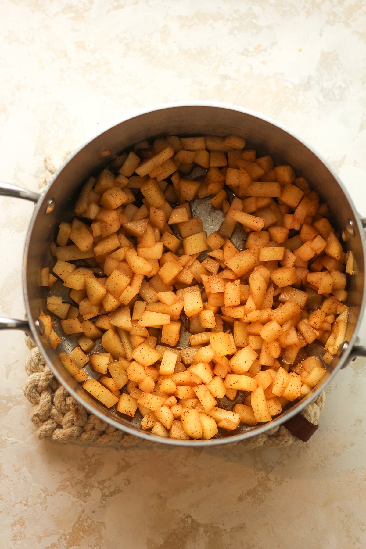 A pan of the cooked diced apples.