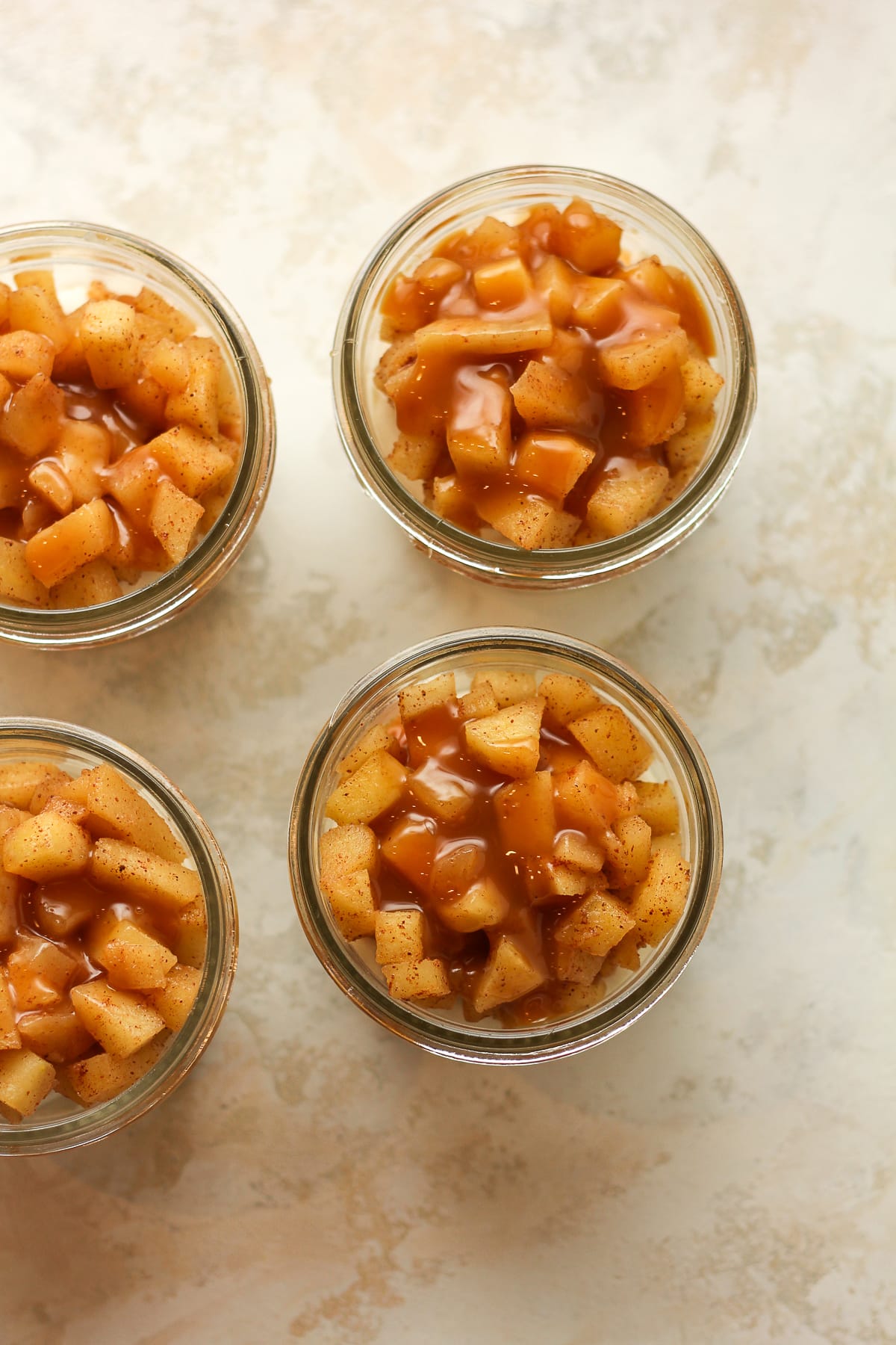 Overhead view of the jars after adding some caramel sauce.