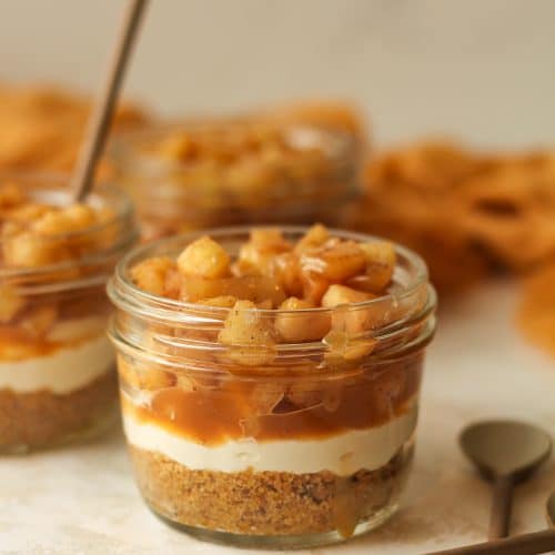 Side view of mason jar apple pie with caramel.