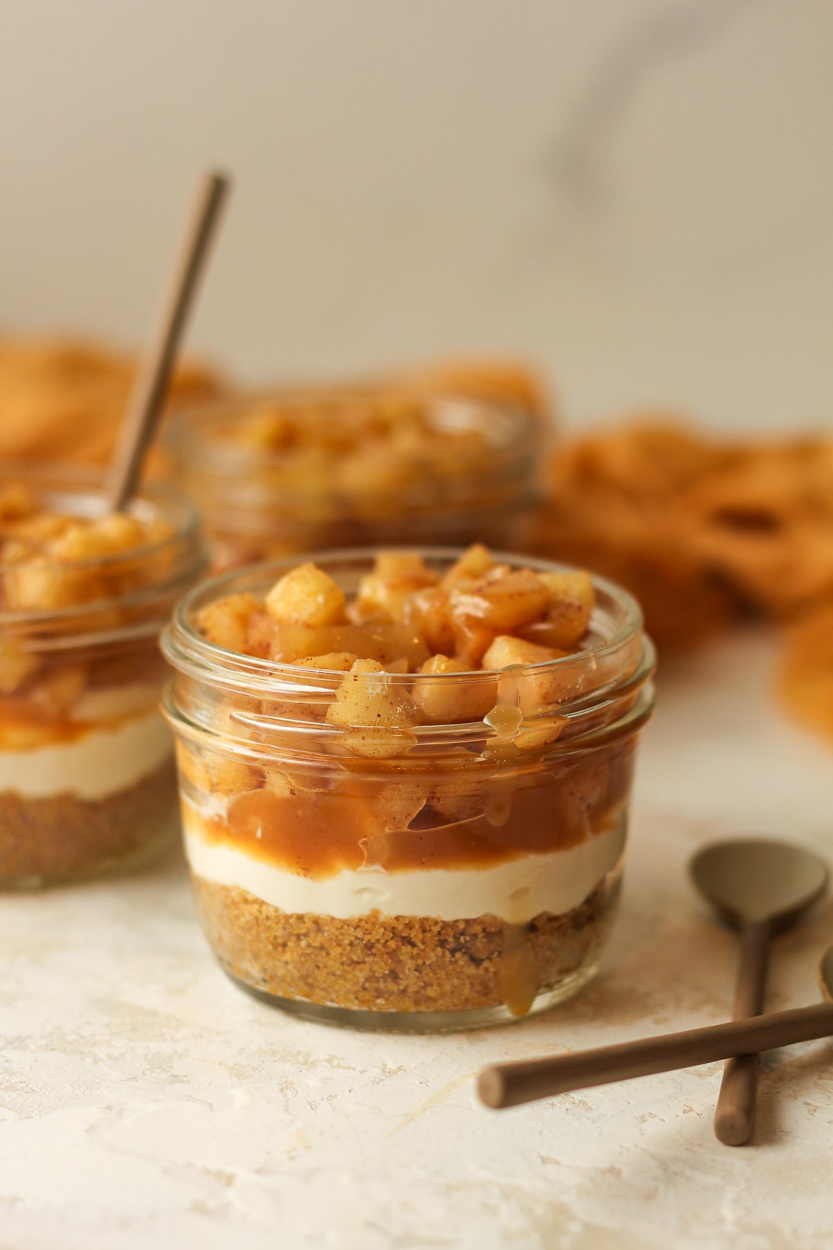 Side view of mason jar apple pie with caramel.