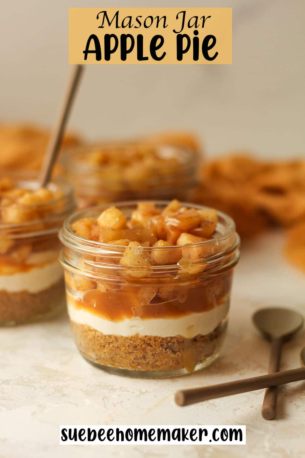 Side view of some jars of mason jar apple pie.