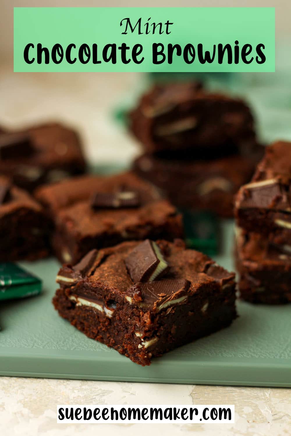 Side view of a green tray of mint chocolate brownies.