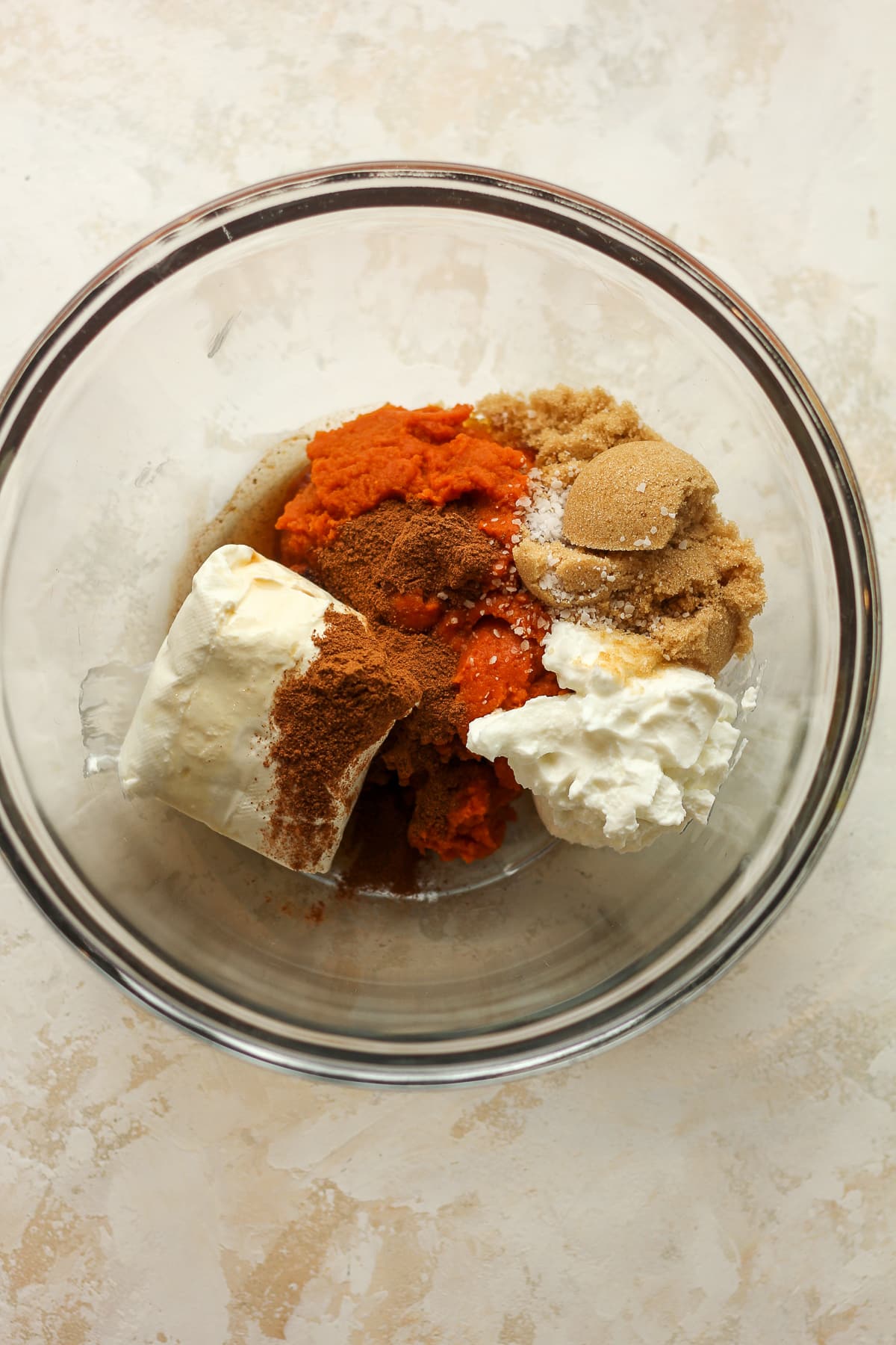 A bowl of the pumpkin layer ingredients.