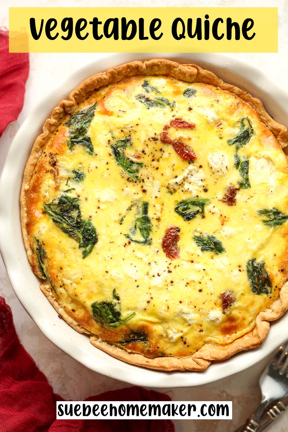 A just baked vegetable quiche with spinach, sun-dried tomatoes, and goat cheese.