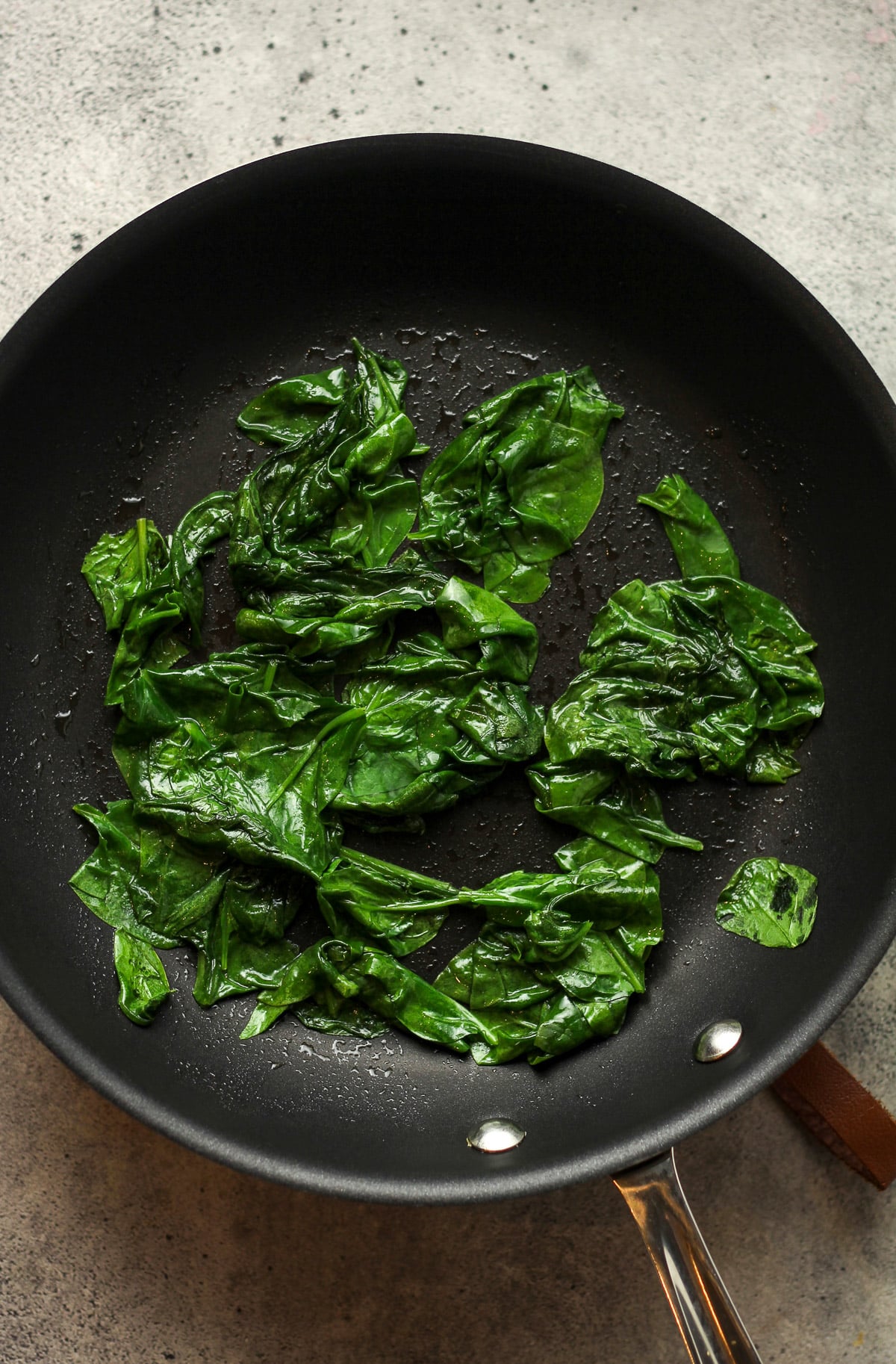 a pan of sautéed spinach.