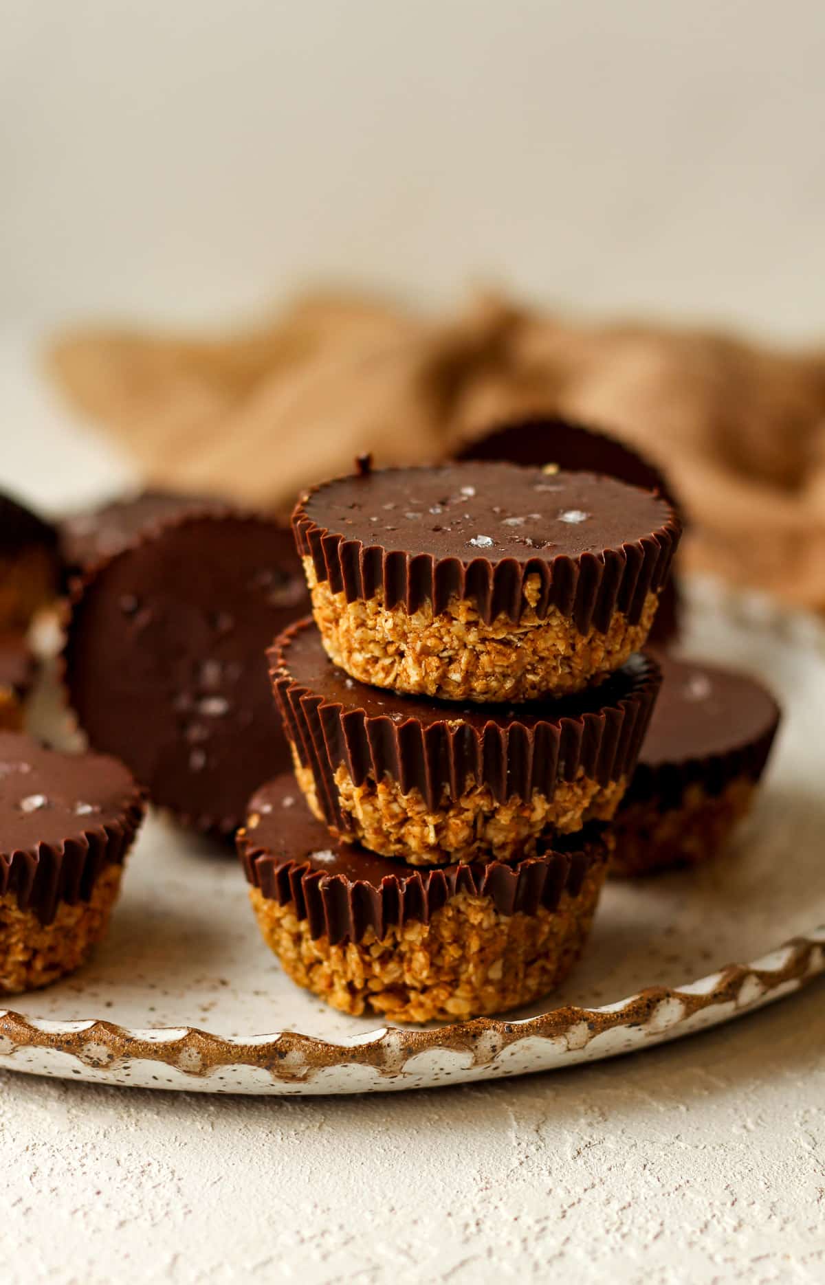 A stack of three peanut butter cups with chocolate on top.