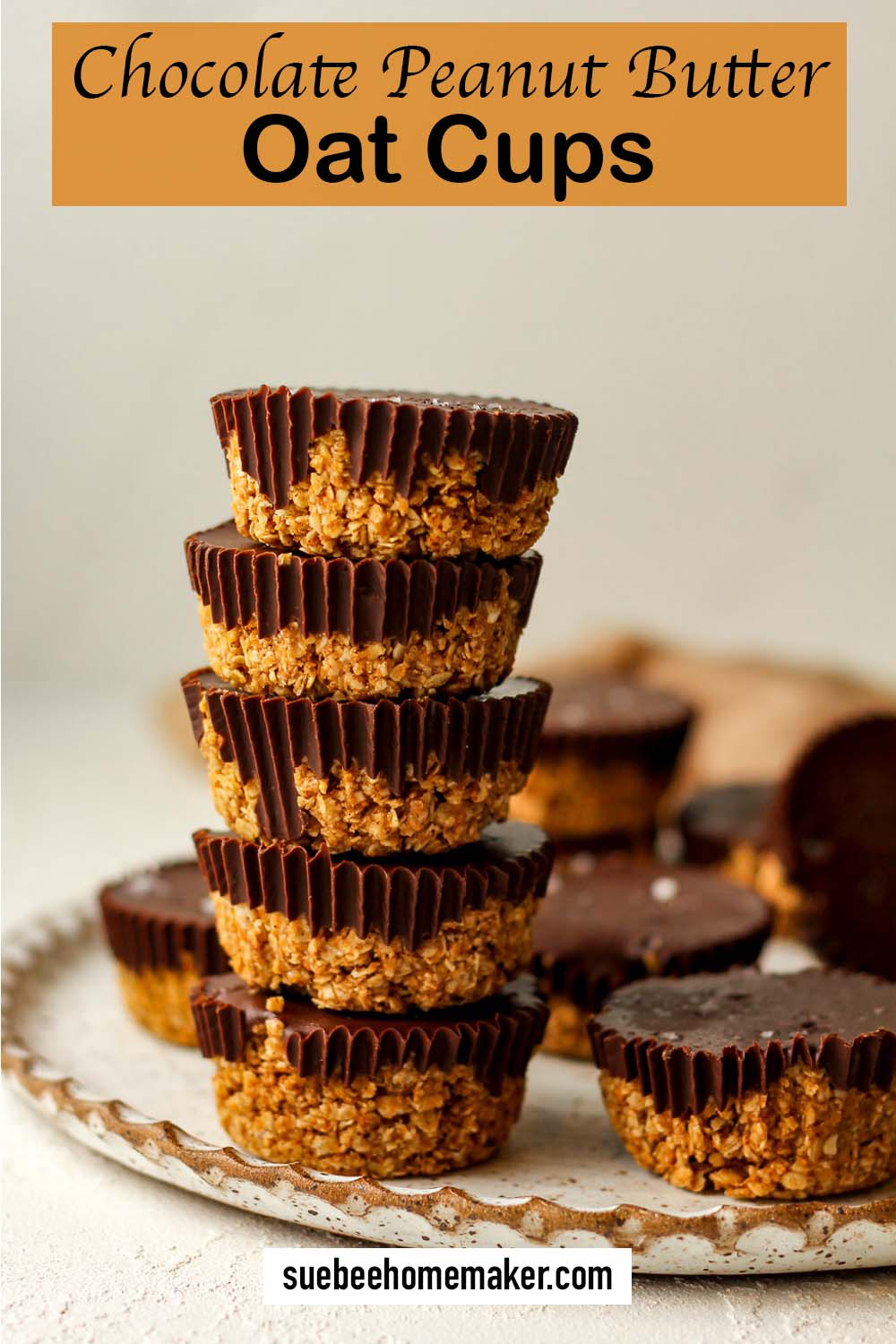 A plate with a stack of five chocolate peanut butter oat cups.